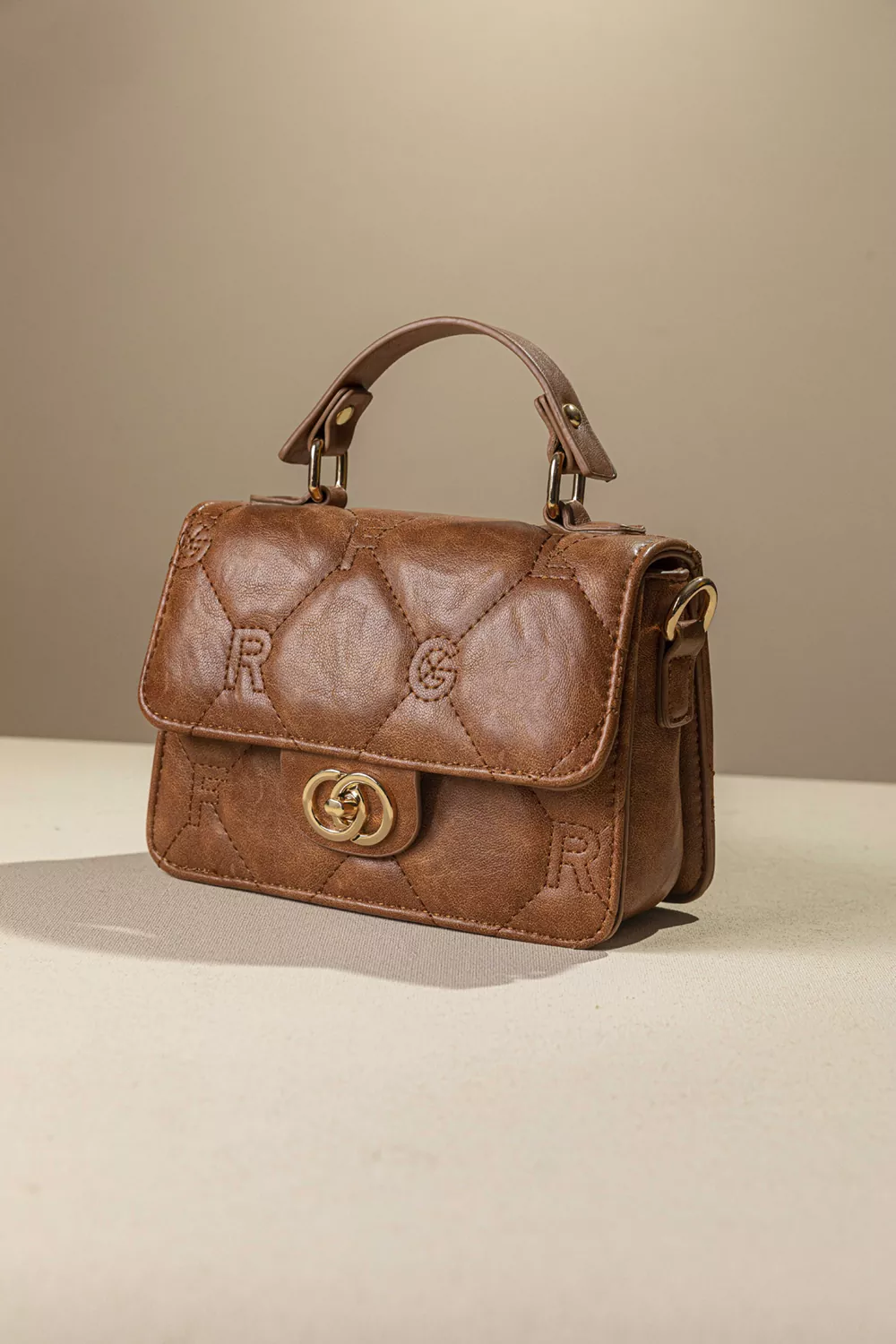 Καπιτονέ τριθέσια τσάντα χειρός