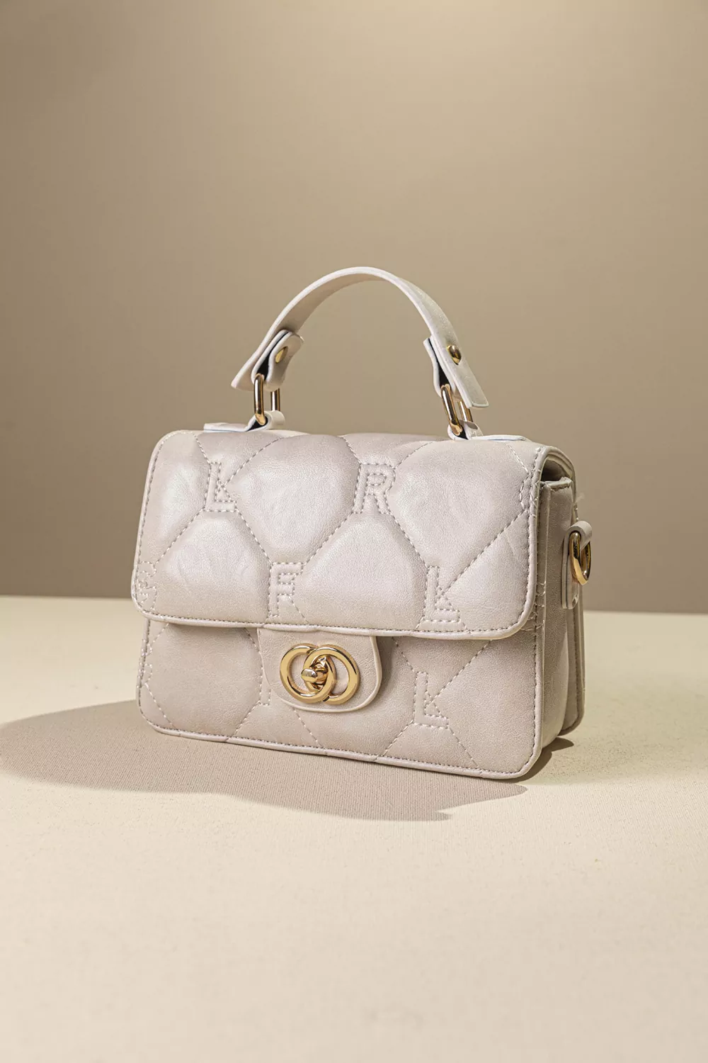 Καπιτονέ τριθέσια τσάντα χειρός